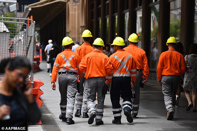 Four construction and development companies thought to be linked have gone bankrupt, leaving 25 projects in the air (stock photo of construction workers)