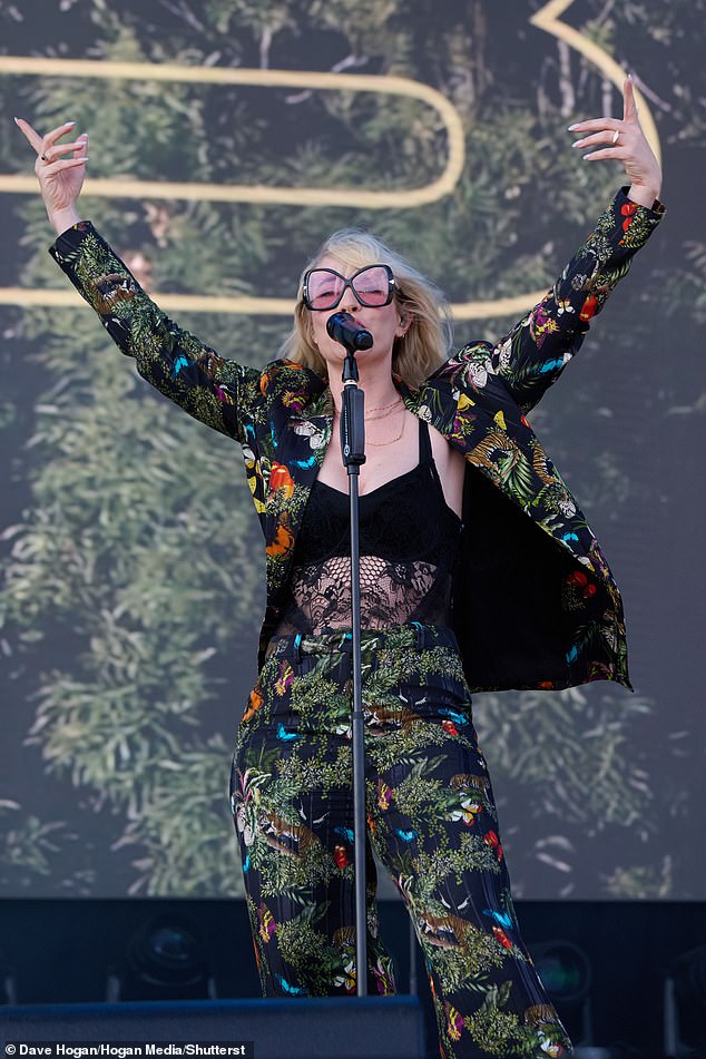 The 42-year-old singer wore an extravagant multi-colored suit with a butterfly print for the event