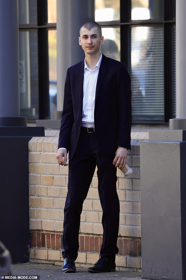 Christopher Carrig appears in Burwood District Court on Tuesday charged with spray-painting a Nazi swastika and a National Socialist Network symbol on statues at Macquarie University