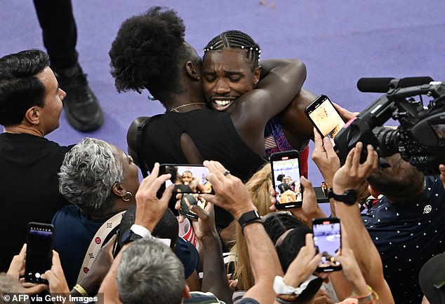 Lyles celebrates with Bromfield after taking gold in the 100 meters in a dramatic final on Sunday