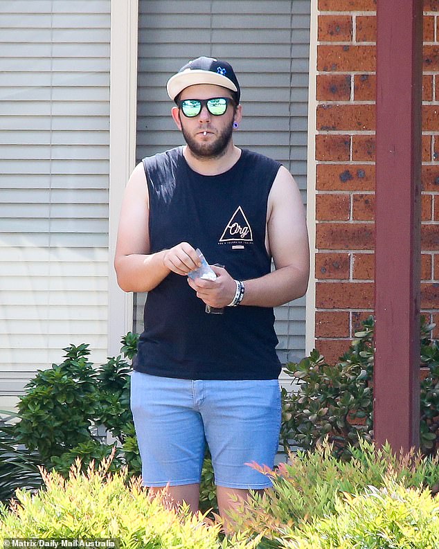 Pictured: Convicted child molester Jessica Isabelle Rose, formerly known as Dean Angus Bell, smoking outside his parents' home in 2019