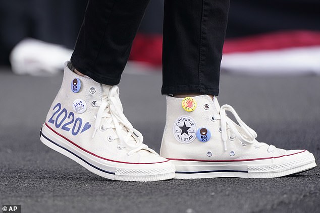 Converse high-top sneakers of Democratic vice presidential candidate Sen. Kamala Harris, D-Calif., are shown as she speaks at a drive-thru early voting event,