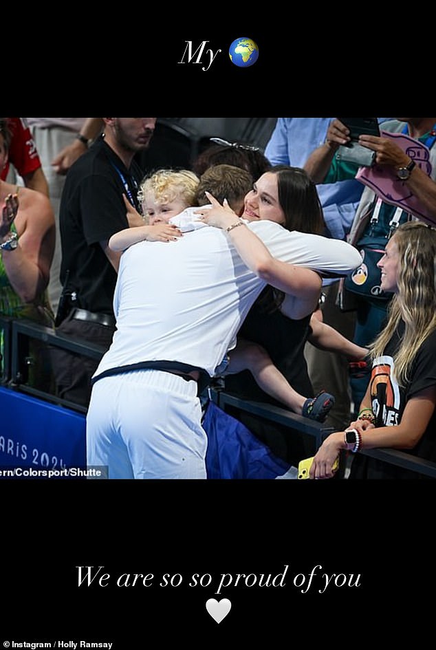 She shared a photo of the athlete hugging her and his son George, three, and wrote: 