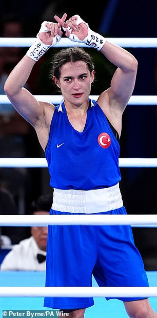 Turkey's Esra Yildiz Kahraman makes an 'X' sign to appeal her loss to Lin Yu Ting of China Taipei