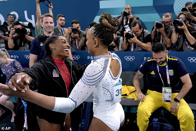 Simone Biles and her biggest rival Rebeca Andrade embraced during the vault final on Saturday