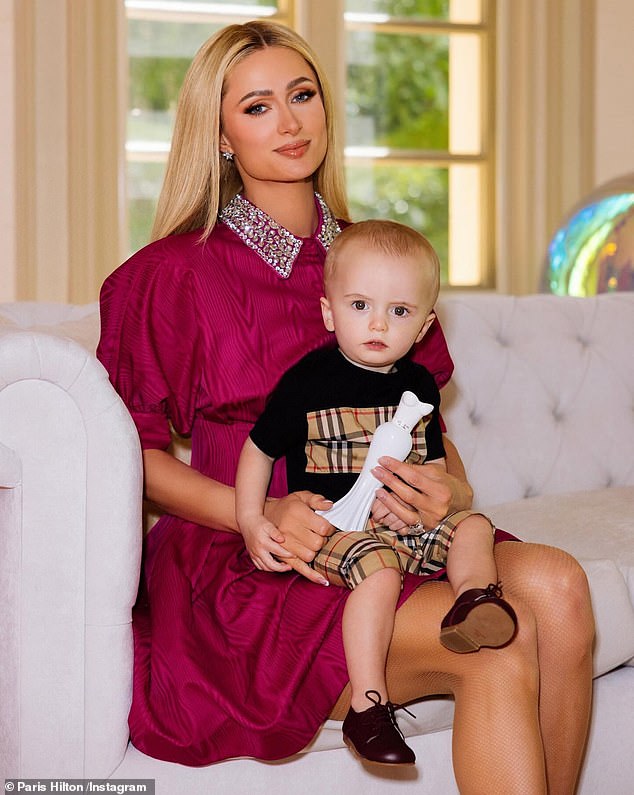 Paris Hilton proved herself to be a devoted mother when she showered her adorable children with love in an adorable home video on Saturday; (Paris and son Phoenix in April)