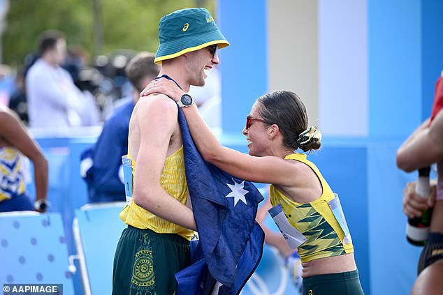 Rhydian Cowley and Jemima Montag celebrate their bronze medal win in the mixed marathon race walking relay