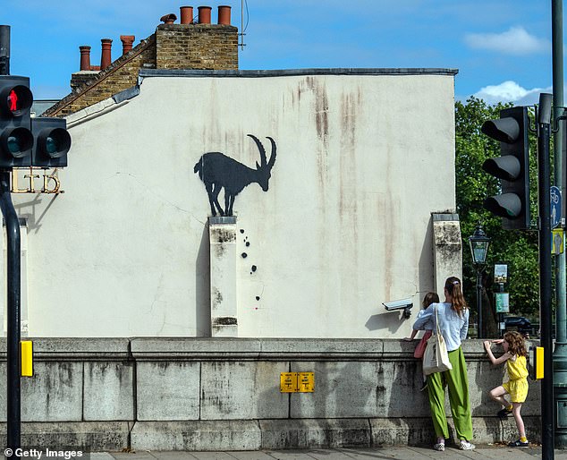 Banksy on Monday placed an artwork of a goat sitting on top of a wall at Kew Bridge in Richmond