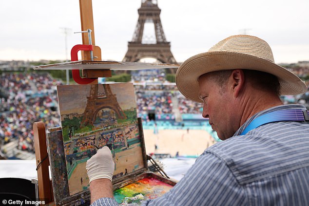 The US has an Olympic gold medal in watercolors to its name from the 1932 Games in LA (Pictured: Artist Peter Spens painting the Eiffel Tower during the Paris Olympics this summer)