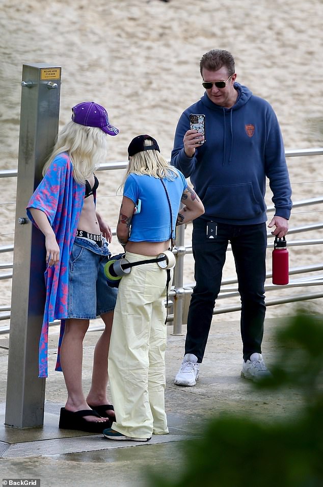 Peter Overton, 58, (right) looked every bit the devoted stage dad on Friday as he was spotted on the set of his daughter Allegra, 17, (left),'s latest fashion shoot wearing Bonds underwear