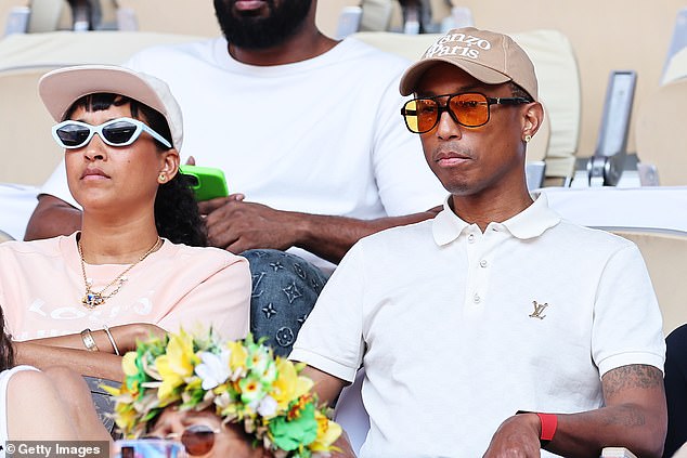 Pharrell Williams and his wife Helen Lasichanh appeared to watch the men's singles semifinal on the seventh day of the Paris Olympics with a straight face on Friday.