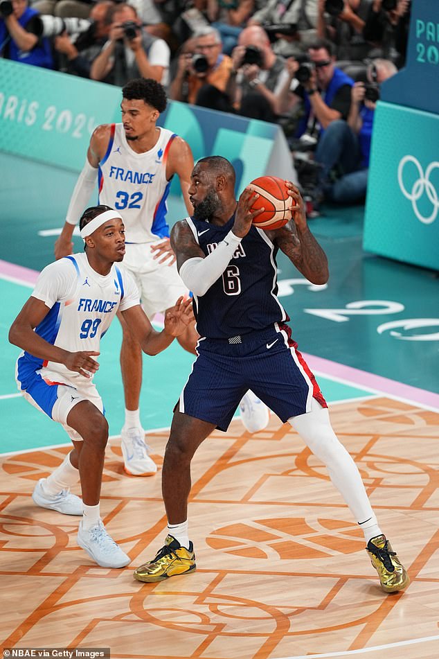 LeBron James (right) wore gold sneakers during Team USA's Olympic final against France