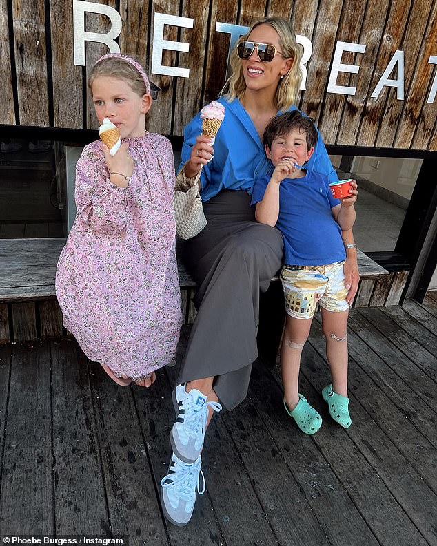 The ex-NRL WAG, who shares two children with ex-husband Sam Burgess, admitted it's 'not always easy' being a single mother but is very grateful for her close support network. Pictured: Phoebe (centre) with her daughter Poppy (left) and son Billy (right)