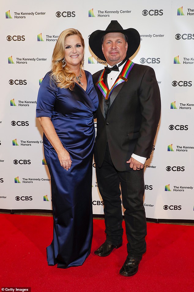 The 62-year-old musician (pictured with his wife Trisha Yearwood) is said to be worth $430 million thanks to his impressive music career