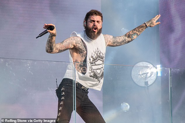 Post Malone's F-1 Trillion album (pictured) is the rapper's sixth studio album (pictured: Post Malone performs in Times Square on July 18)