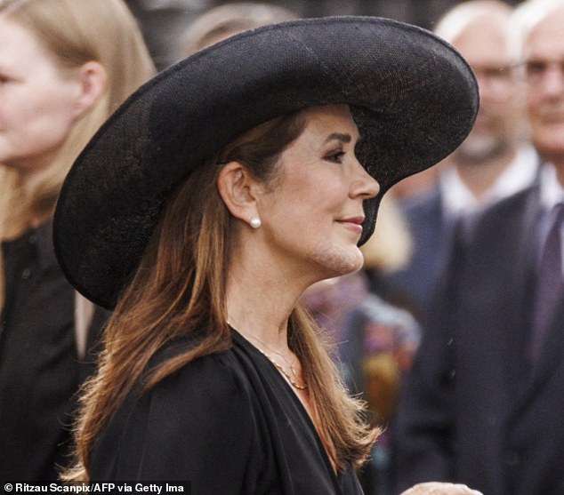 The Australian-born Queen carefully matched her plaster to her skin tone, but the rough texture was hard to miss as she walked into the funeral of former steward Per Thornit in Copenhagen