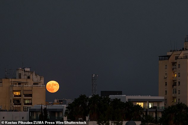 An optical illusion makes supermoons appear largest and brightest when they are close to the horizon.