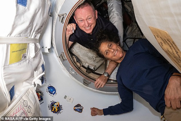 NASA officials say astronauts Barry Wilmore (left) and Sunita Williams (right) are doing well while stranded on the International Space Station, despite reports of dire conditions.