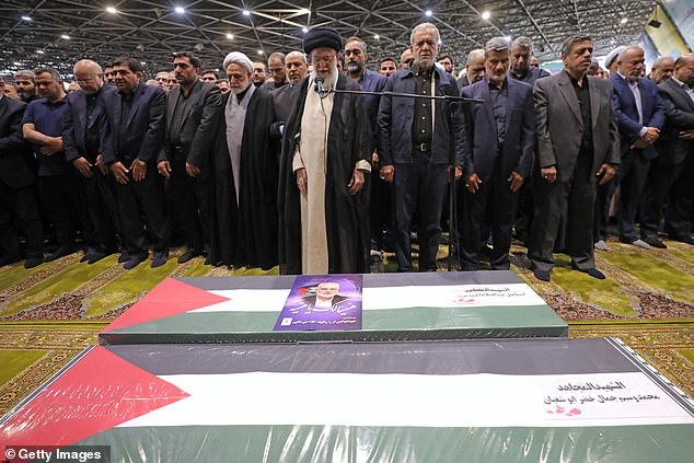 Iran's Supreme Leader Ayatollah Ali Khamenei leads a prayer at the coffins of Hamas leader Ismail Haniyeh and his bodyguard, who were killed in an assassination blamed on Israel