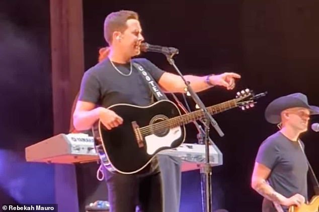 Country singer Scotty McCreery interrupted his show to throw out a man who allegedly punched a woman in the audience