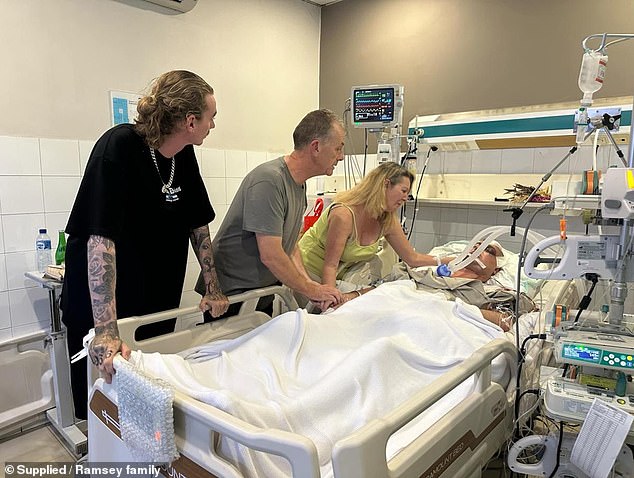 Shane Ramsey's family prepares to turn off his ventilator (pictured at the hospital)