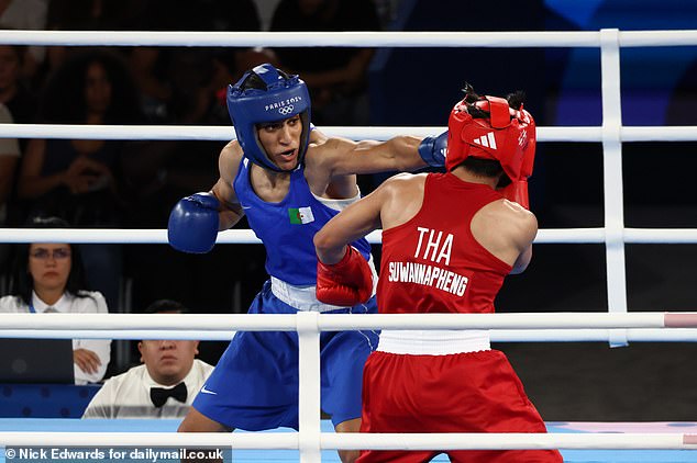 Imane Khalif punches Janjaem Suwannapheng in the face during the semi-final of the women's 66kg boxing event at the 2014 Paris Olympics