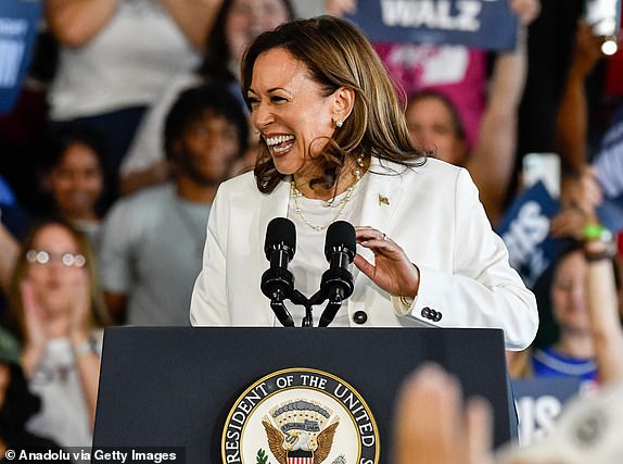 ROMULUS, MICHIGAN - AUGUST 7: Current Vice President and 2024 Democratic presidential candidate Kamala Harris speaks to thousands of attendees during her presidential campaign rally at the Detroit Metropolitan Wayne County Airport in Romulus, MI on August 7, 2024. (Photo by Adam J. Dewey/Anadolu via Getty Images)