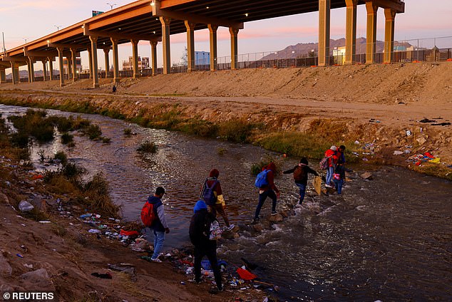 Migrants crossed the Rio Bravo River near El Paso in 2022 on their way to report to U.S. border patrol and seek asylum