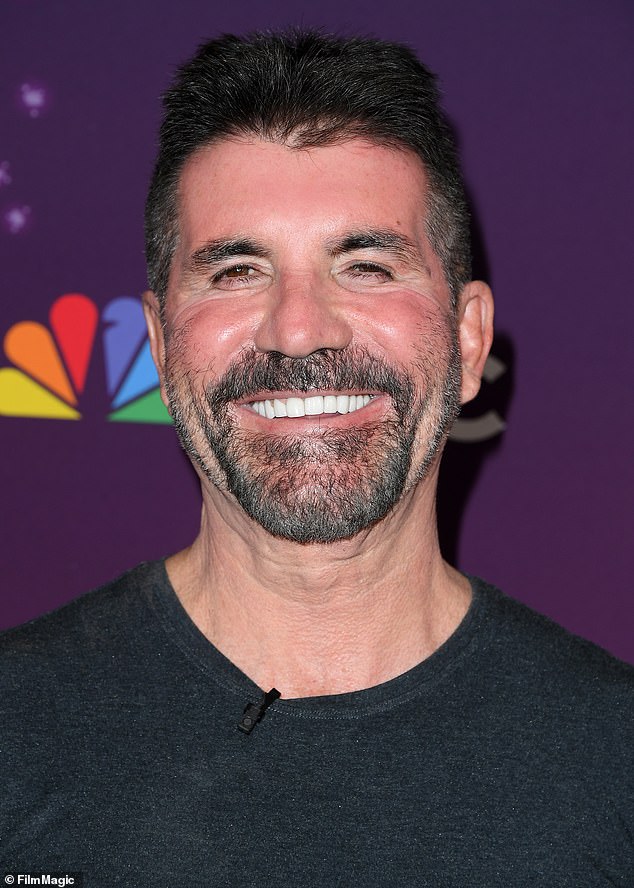 Simon Cowell showed off his Hollywood smile as he posed for photos ahead of the America's Got Talent quarter-finals on Tuesday