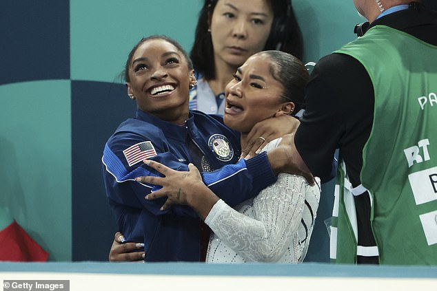 Simone Biles (L) and Jordan Chiles (R) of Team United States after the floor exercise