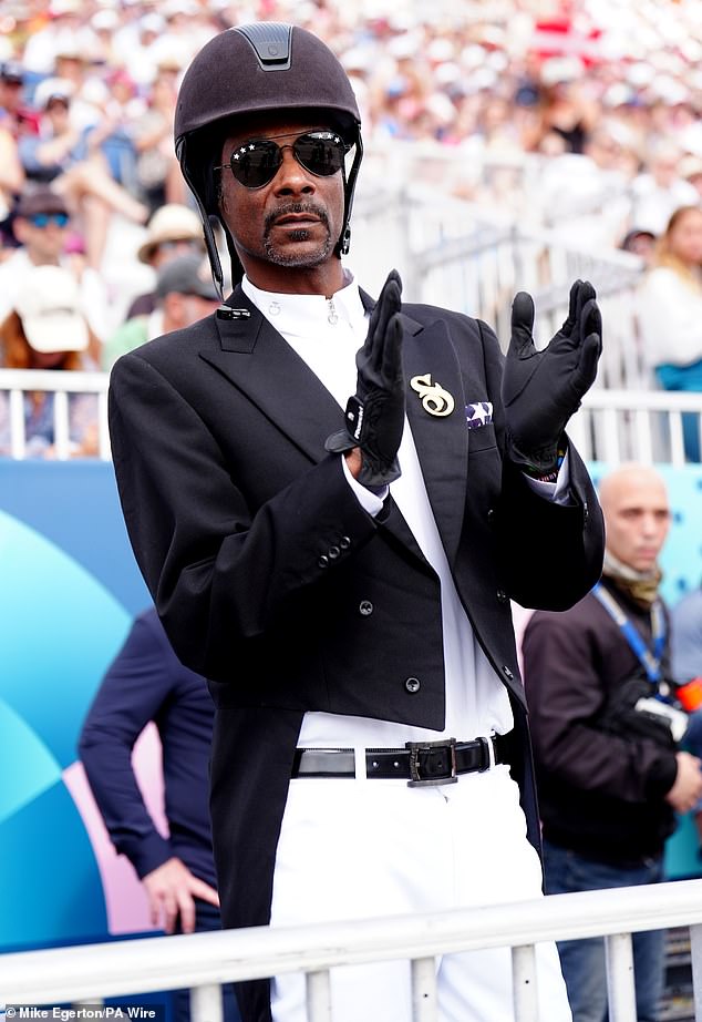 Snoop Dogg was dressed in pants, a dressage skirt and a helmet in Versailles on Saturday