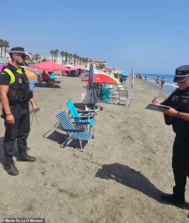 Police officers in Malaga confiscate empty beach chairs