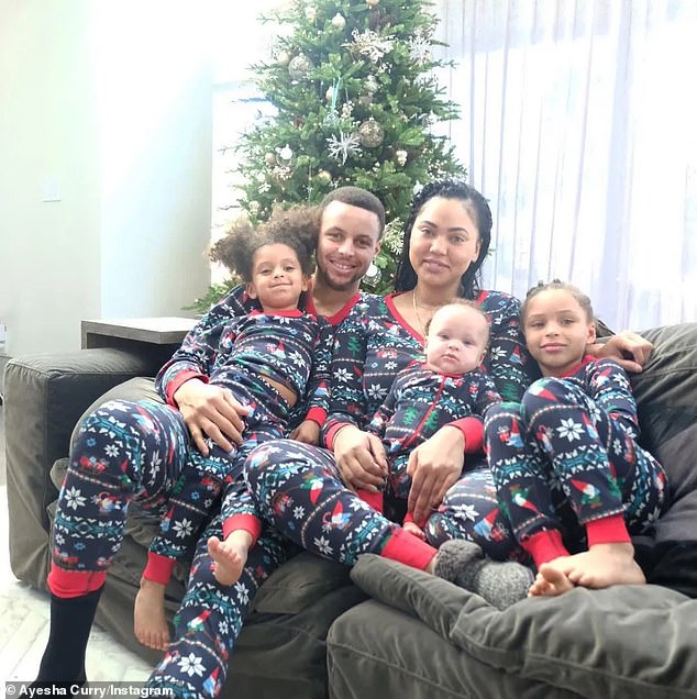 PICTURED: Stephen, Ayesha, Riley (far right), Ryan (far left) and Canon Curry (on Ayesha's lap)