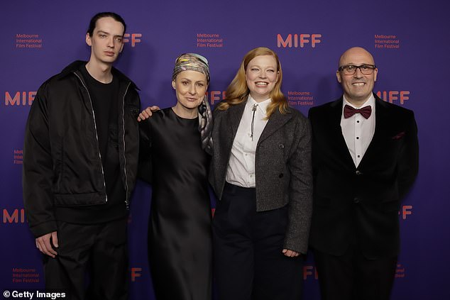 She looked elegant as she posed alongside her co-star Kodi Smit-McPhee (left), director Adam Elliott (right) and producer Liz Kearney