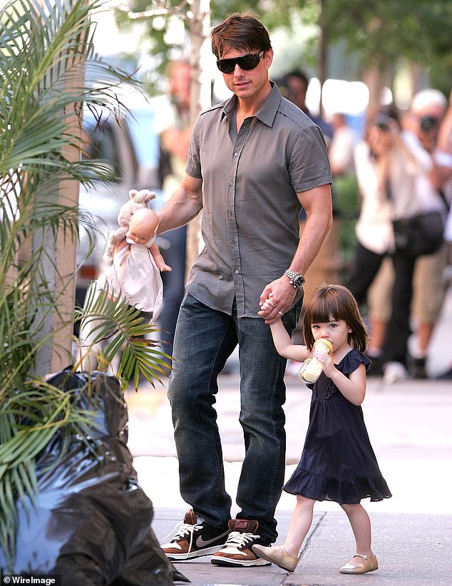 Cruise's father seen with a very young Suri on the streets of Manhattan in 2008 when he was still married to Holmes; seen in 2008