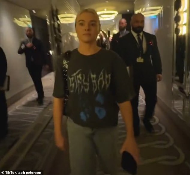 Tash Peterson, 30, was only informed of her ban from Perth Crown Towers two hours after she and her boyfriend checked in (pictured Crown security guards escorting Ms Peterson out)