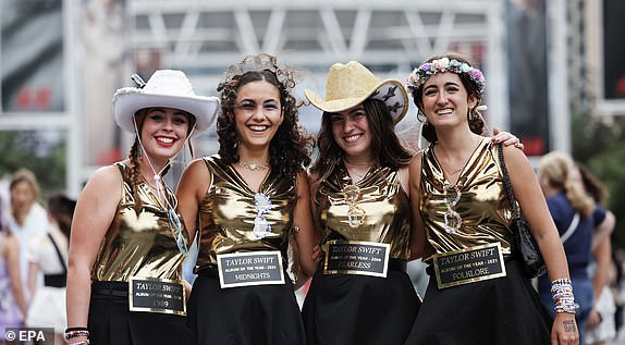 epa11550222 Fans of Taylor Swift pose for photos outside Wembley Stadium before the first concert of the Eras Tour at Wembley Stadium in London, Britain, August 15, 2024. The final concerts of the American pop star's Eras Tour in Europe will take place at Wembley Stadium in London from August 15 to 20, 2024. The concerts will go ahead amid extra security measures following the cancellation of Swift's three shows in Vienna earlier in August 2024. A spokesperson for the London Metropolitan Police said that 