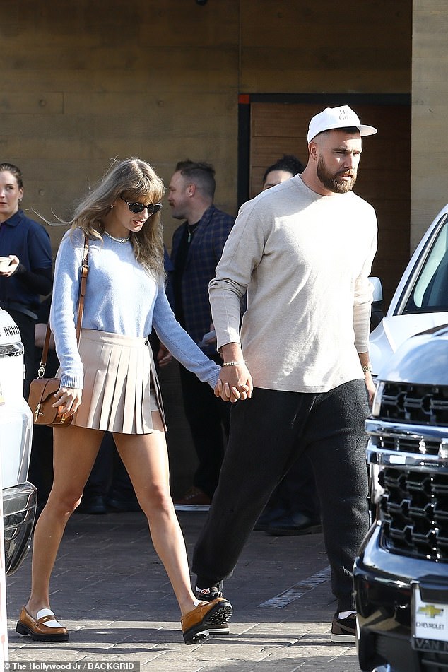 Taylor Swift and Travis Kelce - pictured in March - reunite during her tour break at her famous Rhode Island mansion