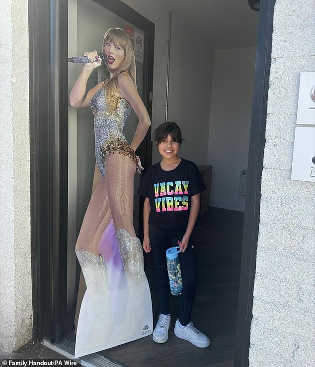 Alice da Silva Aguiar on the day she died next to a cardboard cutout of Taylor Swift - she was ready to go to dance class