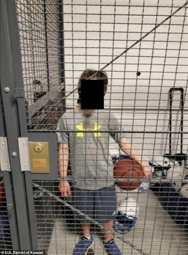 A Kansas paraprofessional who specializes in special needs allegedly took this photo of a student with Down syndrome locked in a shelter cage, while he is accused of subjecting the teen to a flurry of abuse