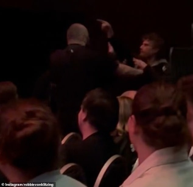 An angry harasser (pictured) had to be removed from the HBF stadium by security on Wednesday night after he walked onto the stage while shouting at the comedian