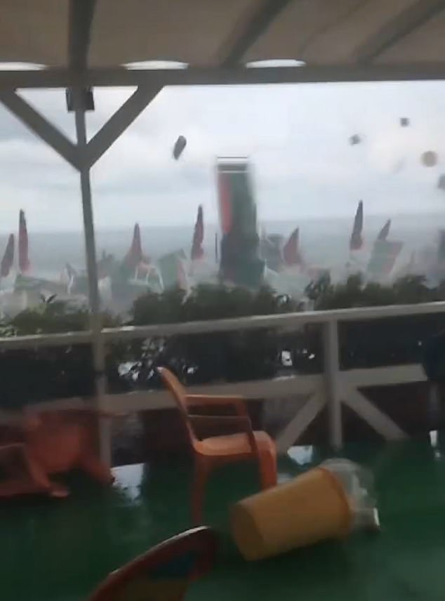 Strong winds, which locals said were the result of a tornado, caused chaos on a beach in Salerno