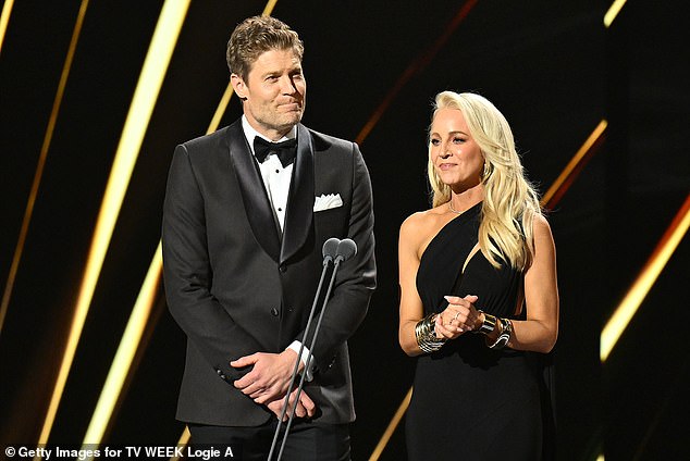 Carrie Bickmore's (right) ex-husband Chris Walker left the Logies ceremony after her flirty interaction with Dr. Chris Brown (left)