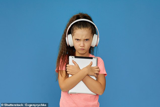 Children who use their tablets for an hour longer per day are more likely to be angry or frustrated a year later, a study finds (stock image)