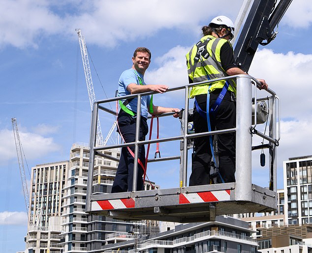 They climbed into cherry pickers and were hoisted high above the show's London studio (Dermot O'Leary pictured)