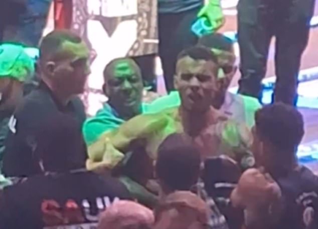 Video footage shows HSTikkyTokky spitting at the crowd involved in the brawl after the fight