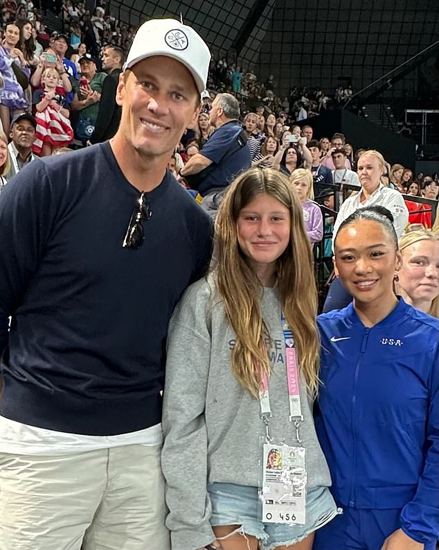 Tom Brady has shared a photo dump from his 'once in a lifetime' trip to the Paris Olympics with his daughter Vivian (centre), where they met up with American gymnast Suni Lee (right)