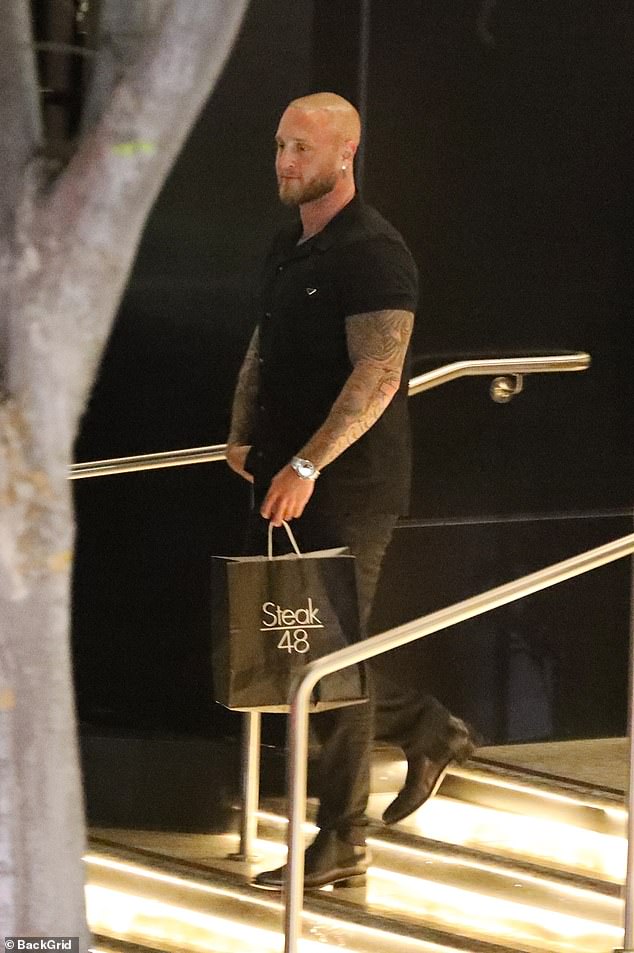 After dining with a friend at the posh steakhouse, the 33-year-old musician looked fresh as he waited for the valet to bring his car