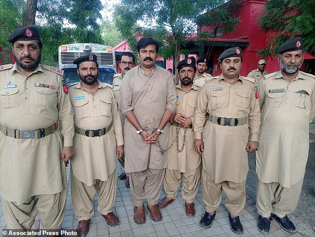 This comes two years after an American vlogger claimed she was gang raped in a hotel in Pakistan by her guide and an accomplice (one of whom is pictured above in handcuffs) who made videos of her to blackmail her.