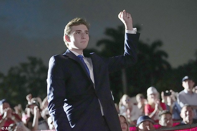 Barron Trump gestures as his father, Republican presidential candidate and former President Donald Trump, speaks during a campaign rally at Trump National Doral Miami, Tuesday, July 9, 2024, in Doral, Florida.